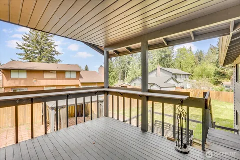 a view of balcony with wooden floor