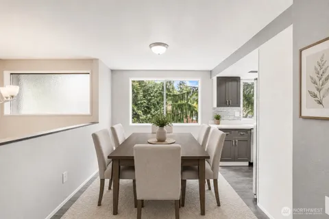 a dining room with furniture and window