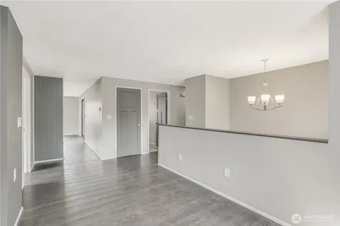 a view of a livingroom with wooden floor