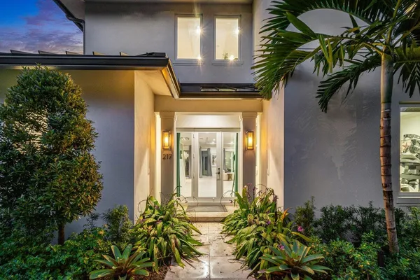 a view of a house with a swimming pool and wooden floor