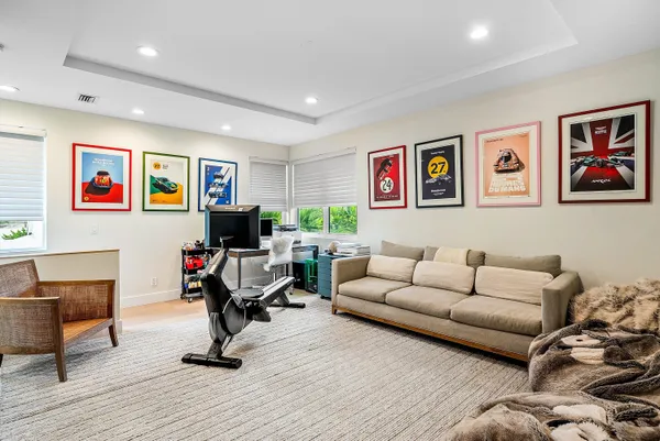 a bedroom with a bed and a television