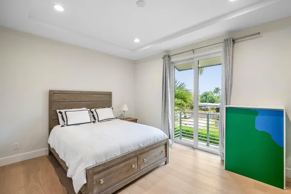 a bedroom with a bed and a couch