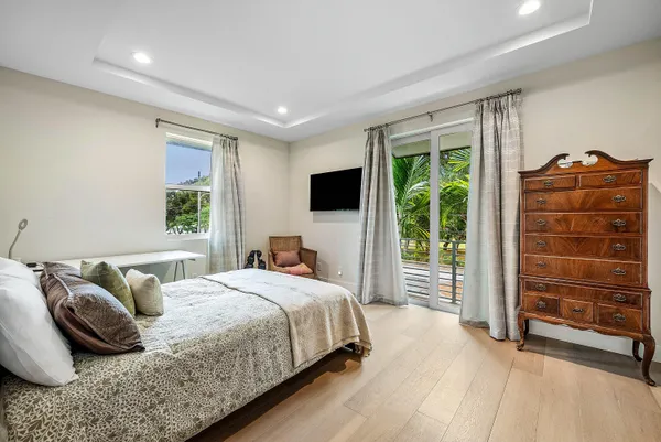 a bedroom with furniture and a window