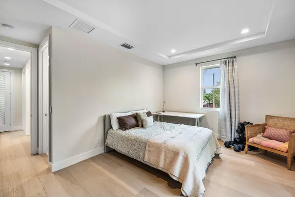 a bathroom with a double vanity sink a mirror and a shower