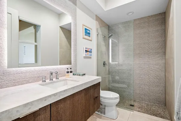 a spacious bedroom with a bed and a couch