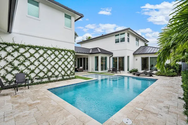 a view of a yard with potted plants