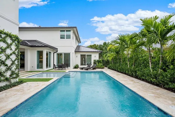 a kitchen with refrigerator and microwave