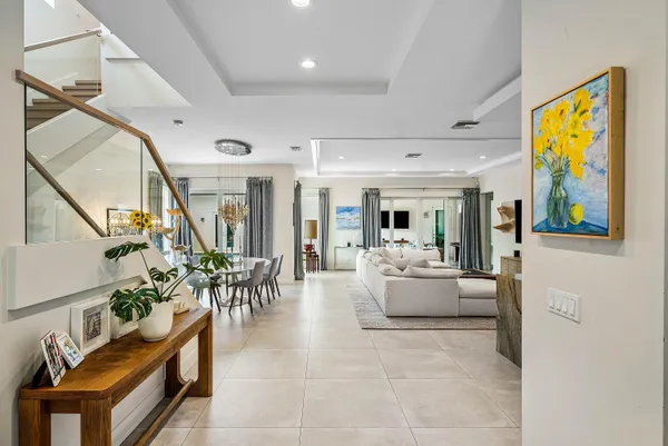 a living room with furniture flat screen tv and a fireplace