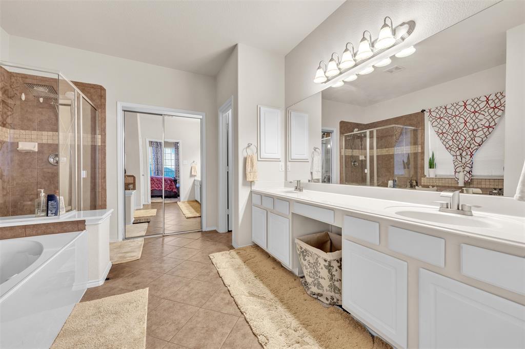 2244 Condor Street Grand Prairie, TX 75052 - Photo 17 of 37 a large white kitchen with a large window and stainless steel appliances