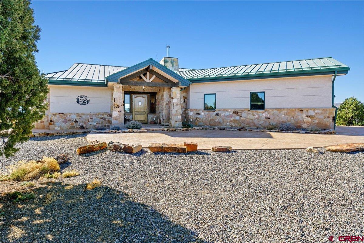 15773 6000th Road Montrose, CO 81403 - Photo 1 of 35 a view of a house with a swimming pool and a yard