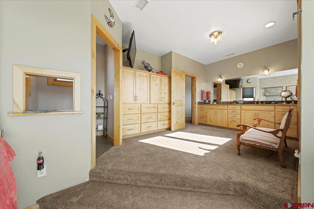 15773 6000th Road Montrose, CO 81403 - Photo 15 of 35 a spacious bedroom with a bed and furniture