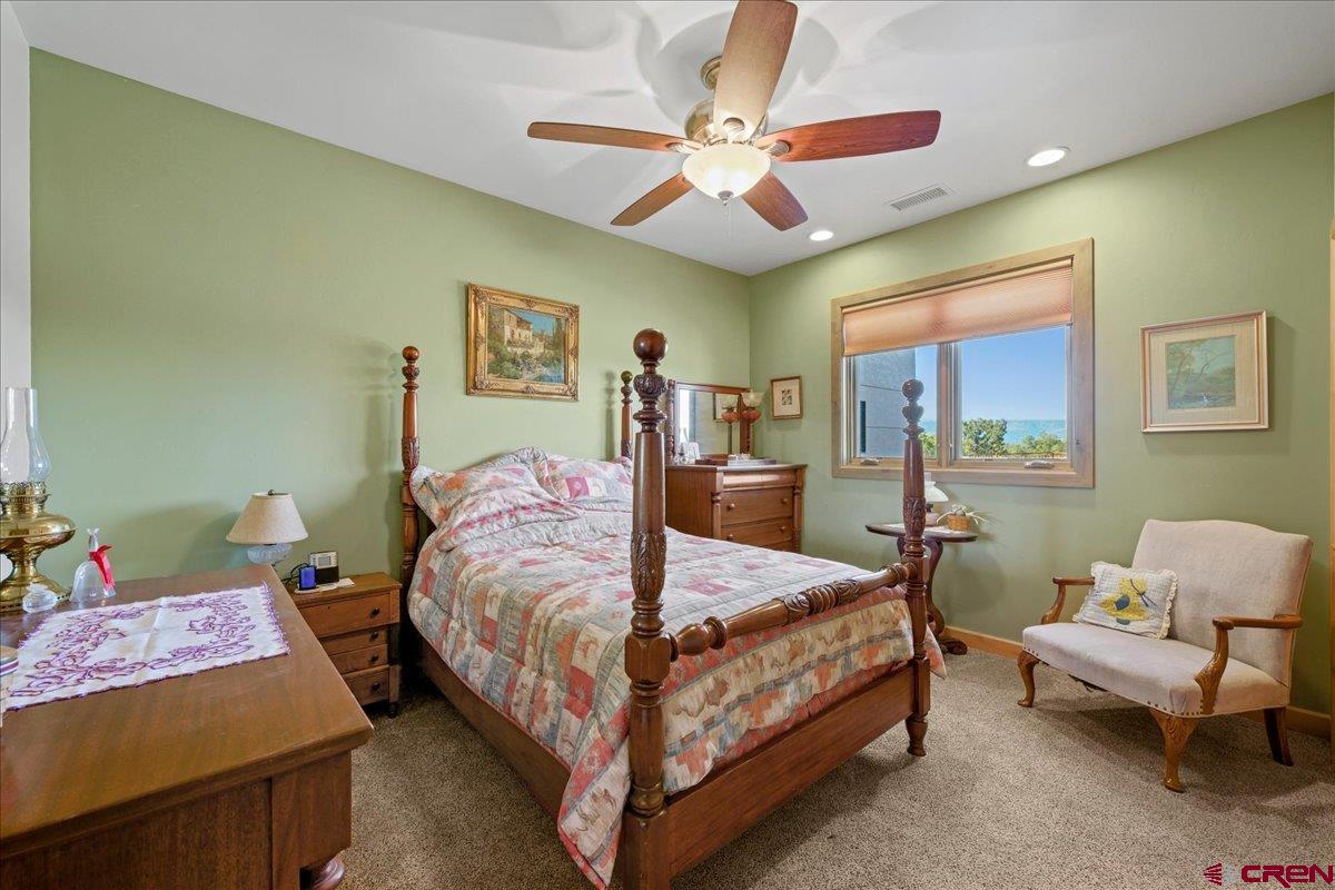 15773 6000th Road Montrose, CO 81403 - Photo 16 of 35 a bedroom with a bed couch and window