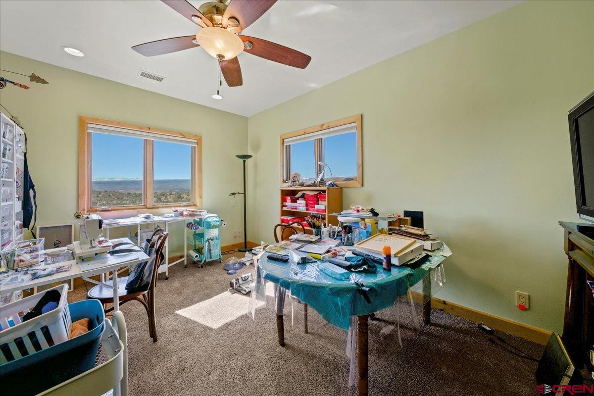 15773 6000th Road Montrose, CO 81403 - Photo 19 of 35 a view of a workspace with furniture and a window