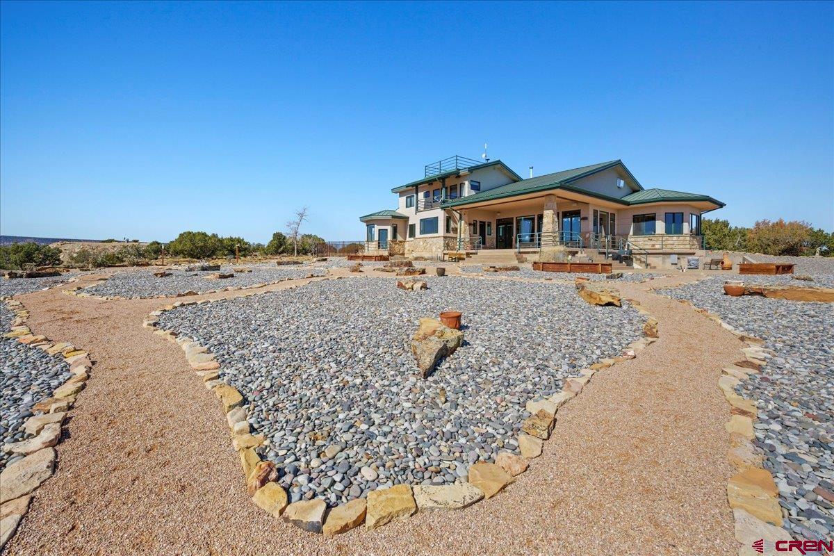 15773 6000th Road Montrose, CO 81403 - Photo 27 of 35 a front view of a house with a yard