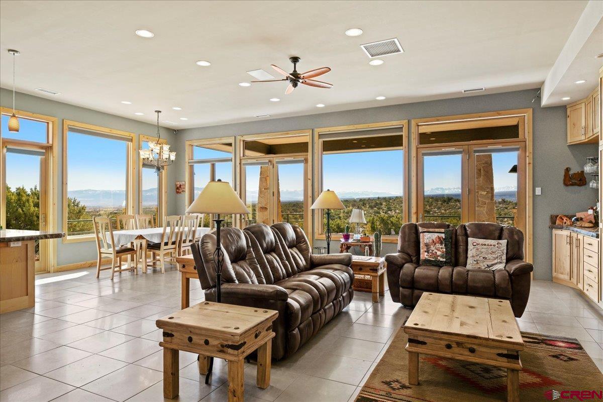15773 6000th Road Montrose, CO 81403 - Photo 5 of 35 a living room with furniture and large windows
