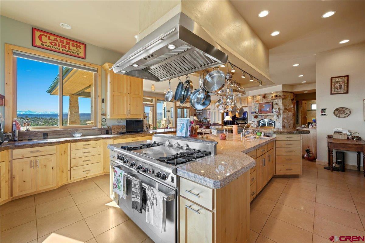 15773 6000th Road Montrose, CO 81403 - Photo 8 of 35 a kitchen with stainless steel appliances granite countertop a stove and a sink
