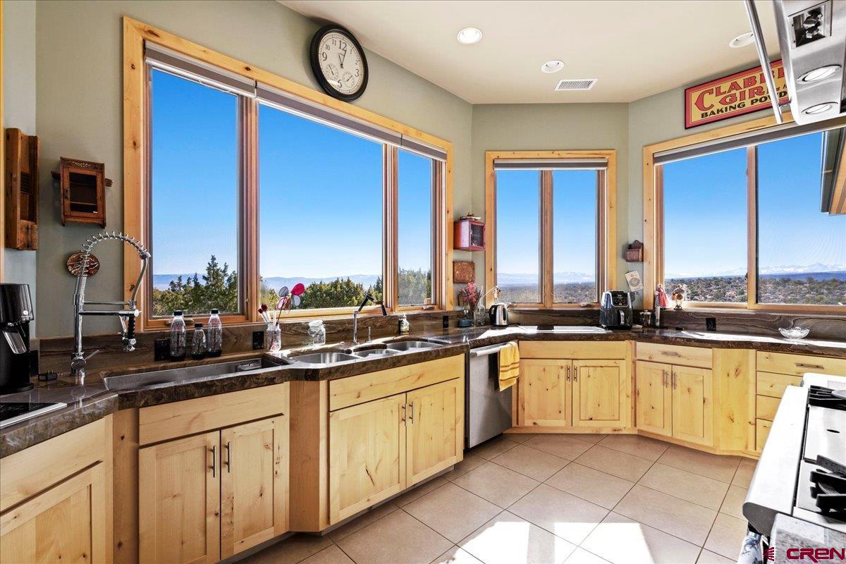 15773 6000th Road Montrose, CO 81403 - Photo 9 of 35 a open kitchen with stainless steel appliances granite countertop a sink and cabinets