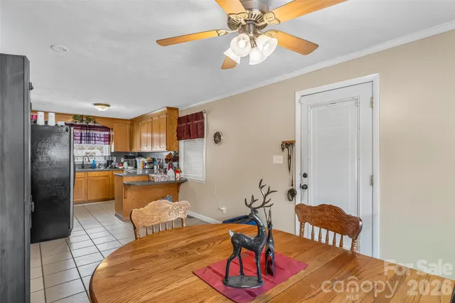 a living room with furniture and a kitchen view