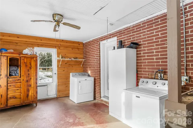 an entryway with a washer and dryer