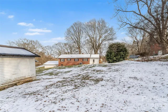 a view of a backyard and snow