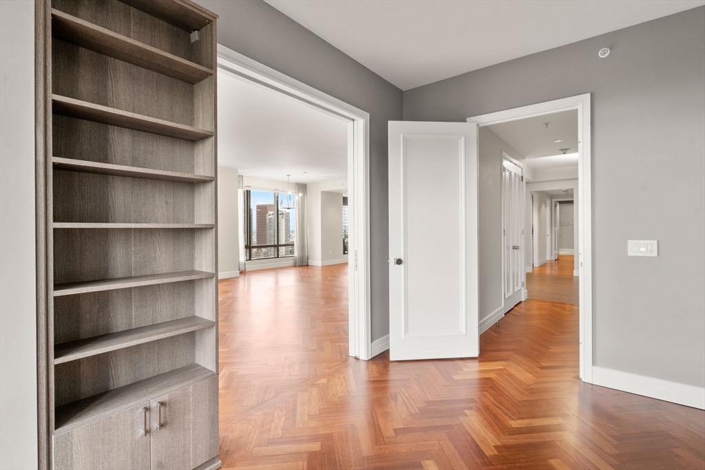 1 Avery Street, Unit 33A Boston, MA 02111 - Photo 12 of 29 a view of a hallway with wooden floor