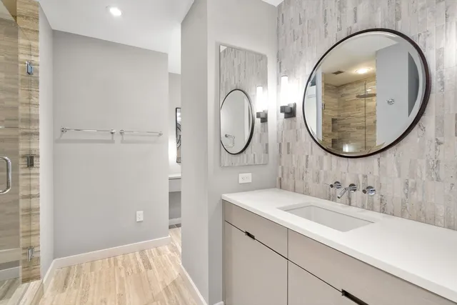 a bathroom with a sink and a mirror