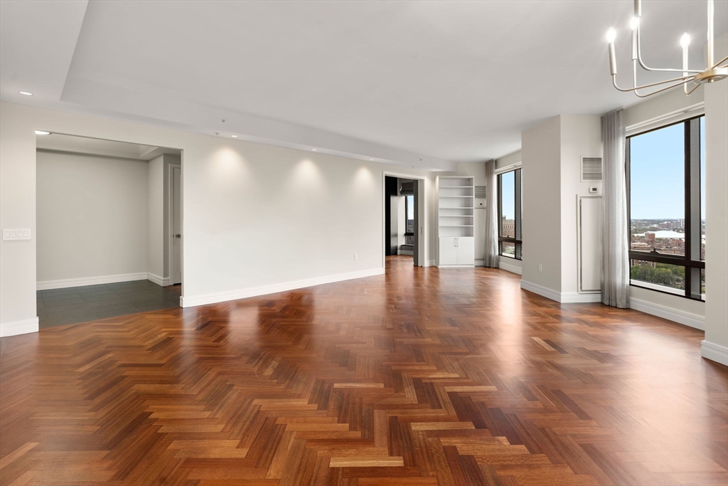1 Avery Street, Unit 33A Boston, MA 02111 - Photo 2 of 29 a view of a livingroom with wooden floor
