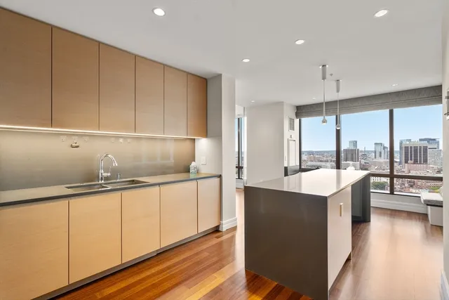 a kitchen with a sink and cabinets