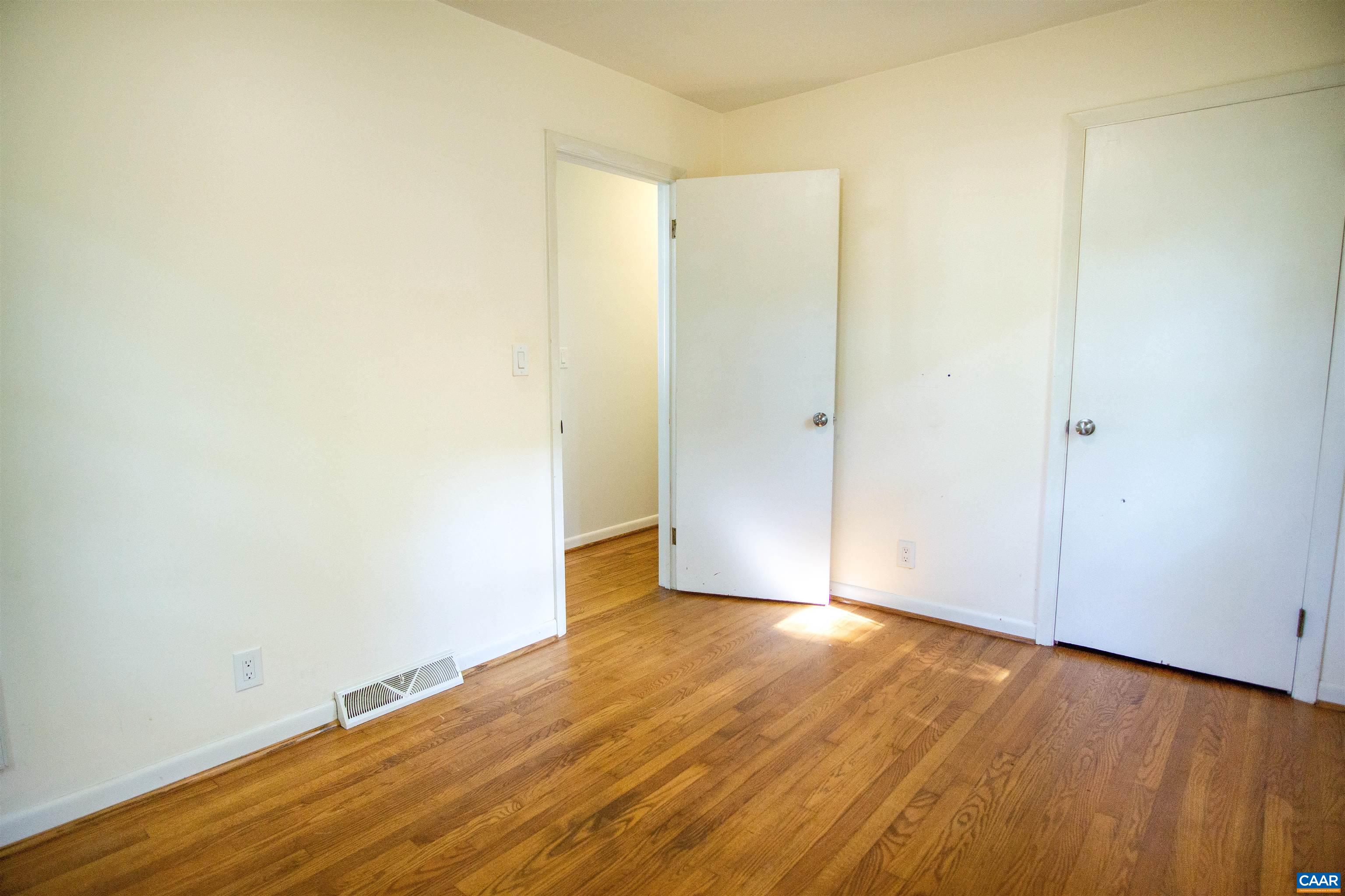 208 Locust Lane Ruckersville, VA 22968 - Photo 17 of 24 a view of an empty room with wooden floor