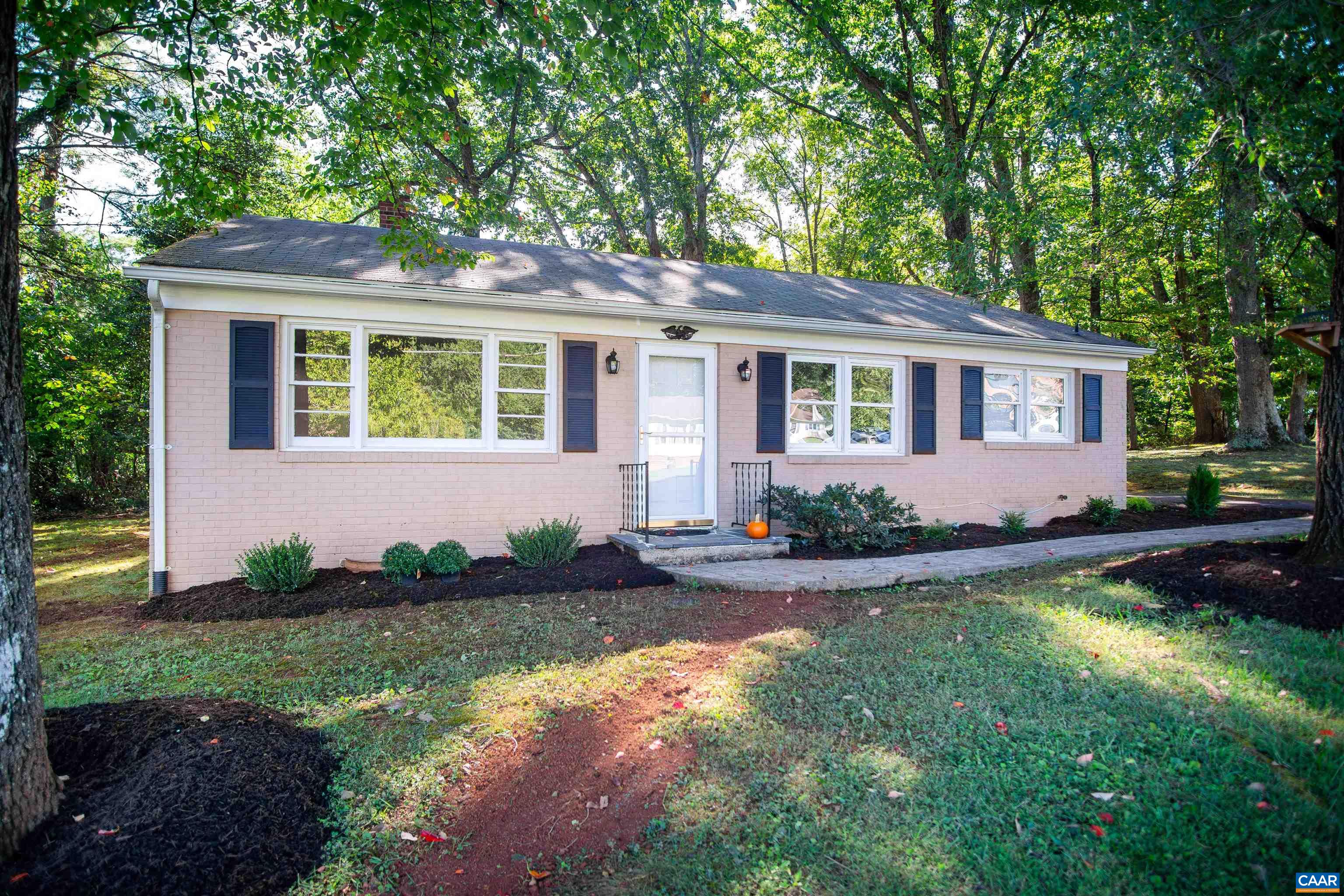208 Locust Lane Ruckersville, VA 22968 - Photo 3 of 24 a front view of a house with a yard