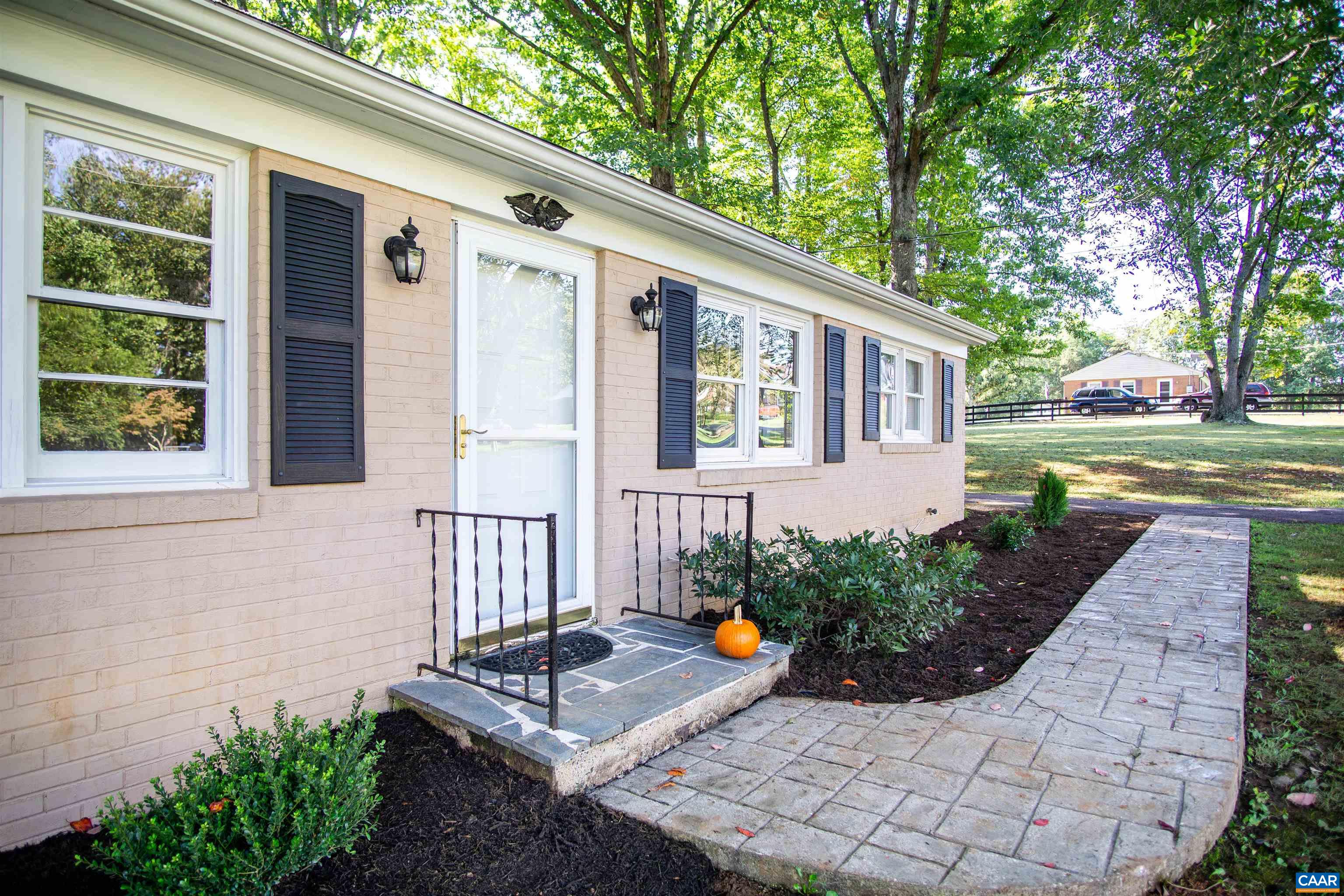 208 Locust Lane Ruckersville, VA 22968 - Photo 4 of 24 a front view of a house with garden