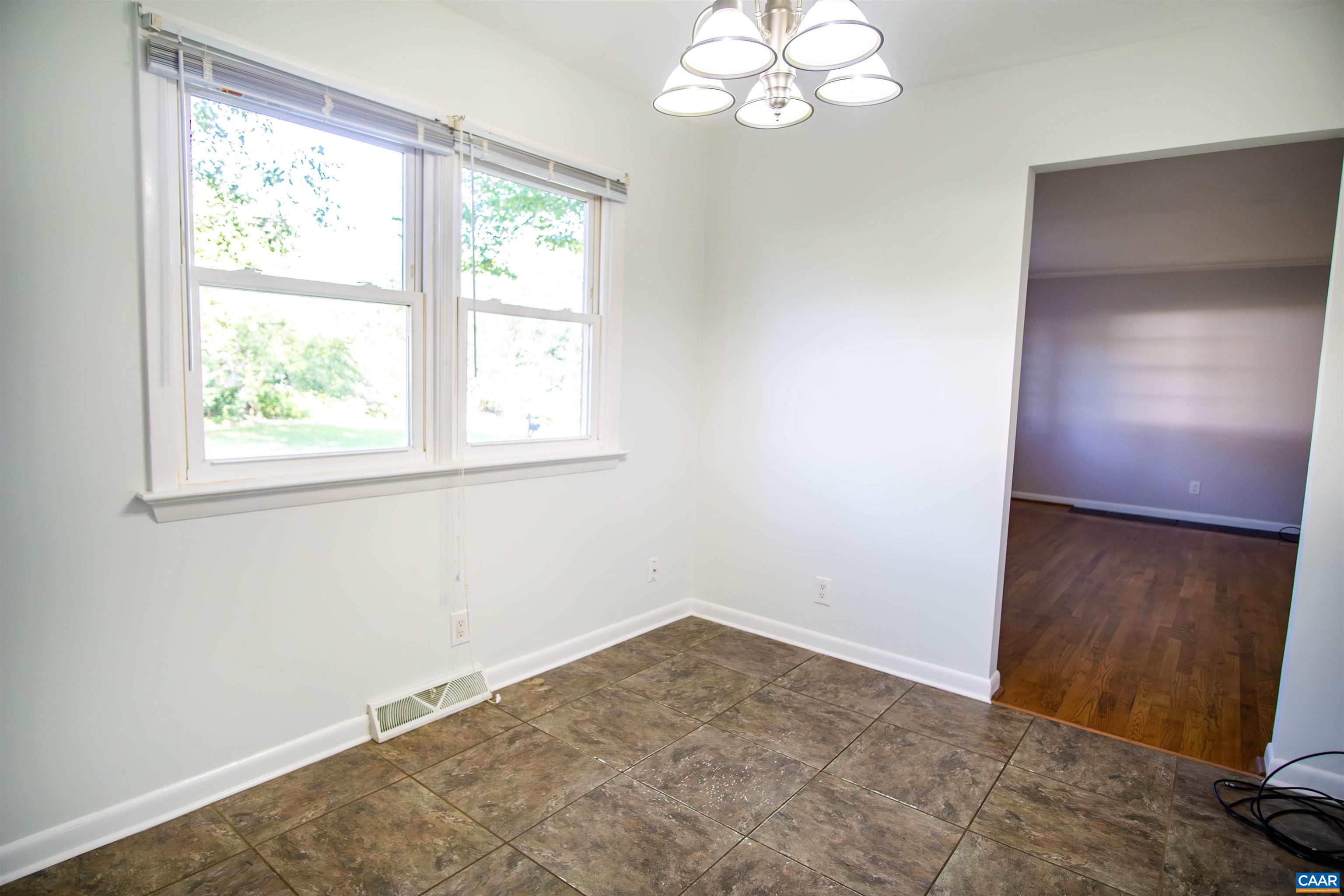208 Locust Lane Ruckersville, VA 22968 - Photo 8 of 24 an empty room with wooden floor and windows