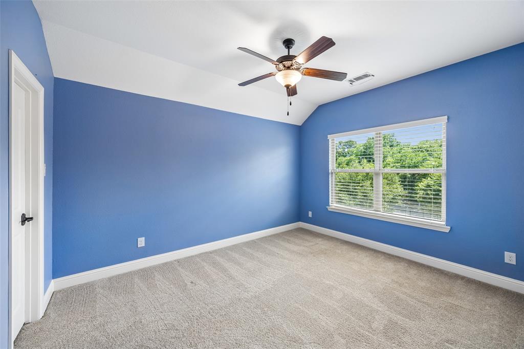 134 Santa Rosa Way Irving, TX 75062 - Photo 21 of 26 Bright secondary bedroom with abundant natural light and a spacious layout.