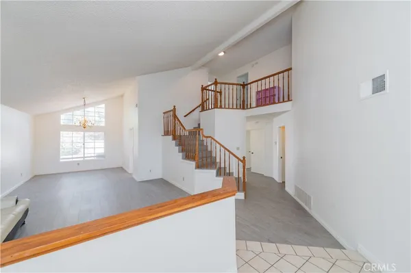 a view of entryway and hall with a front door