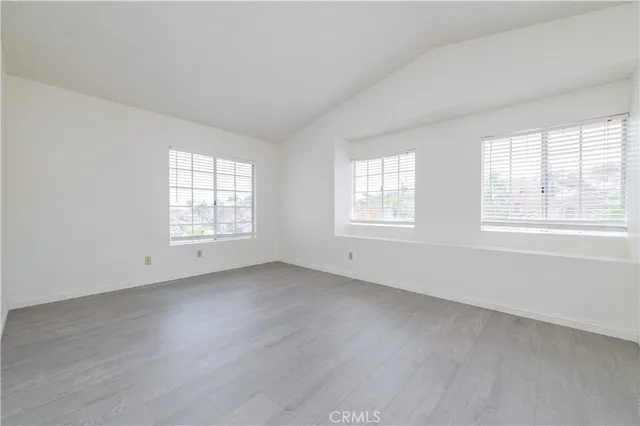 a bathroom with a granite countertop sink toilet a mirror and shower