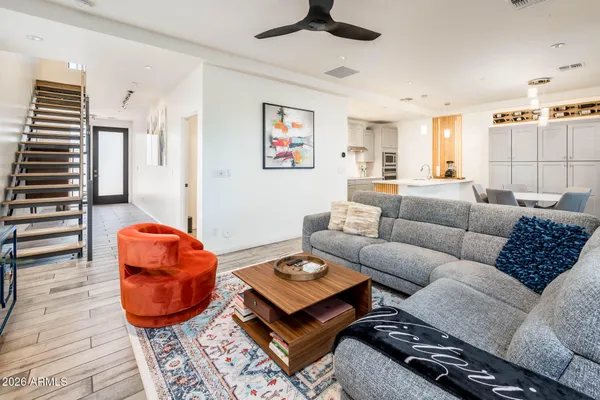a living room with furniture and a large window