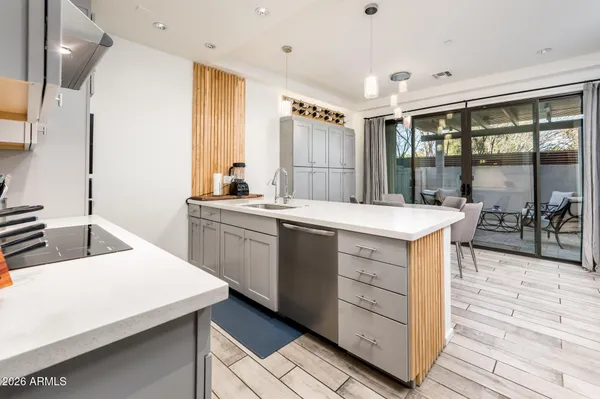 a view of a chairs and table in patio