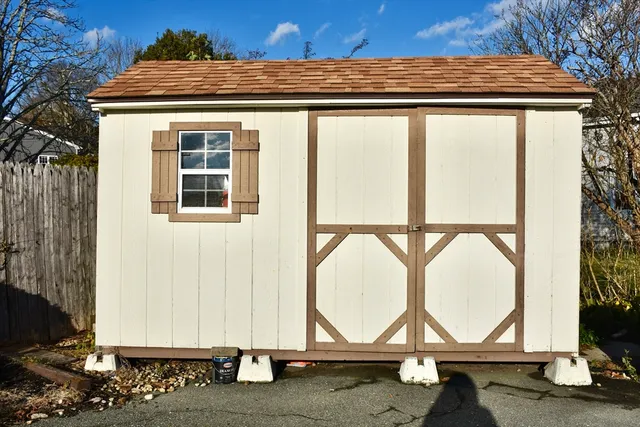 a view of backyard with wooden floor and a window