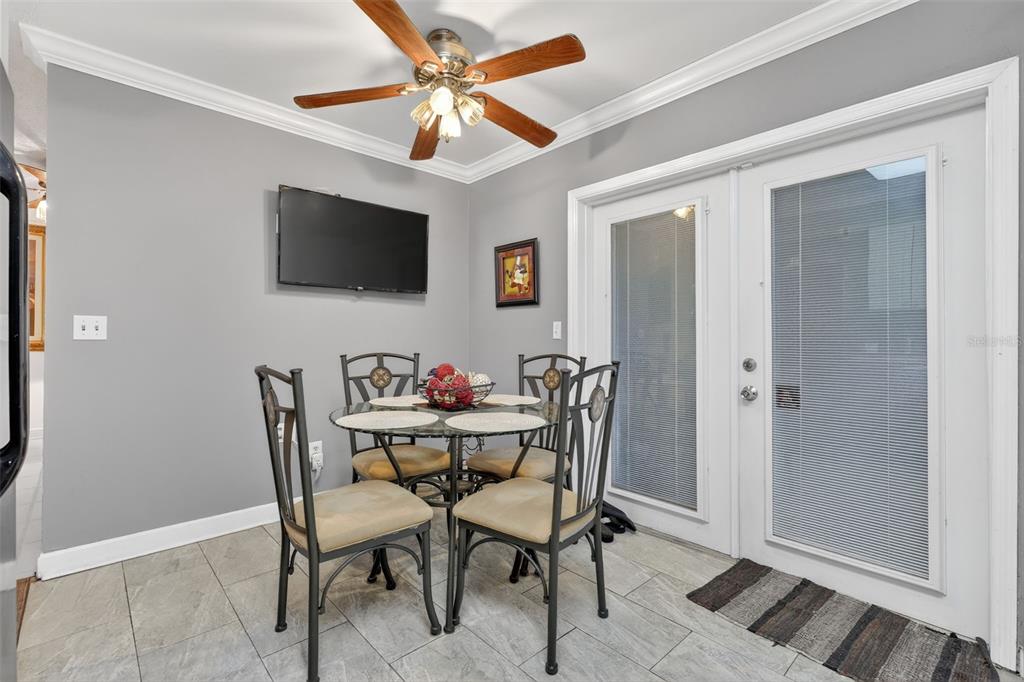 575 Tiberon Cove Road Longwood, FL 32750 - Photo 15 of 56 a dining room with furniture and window