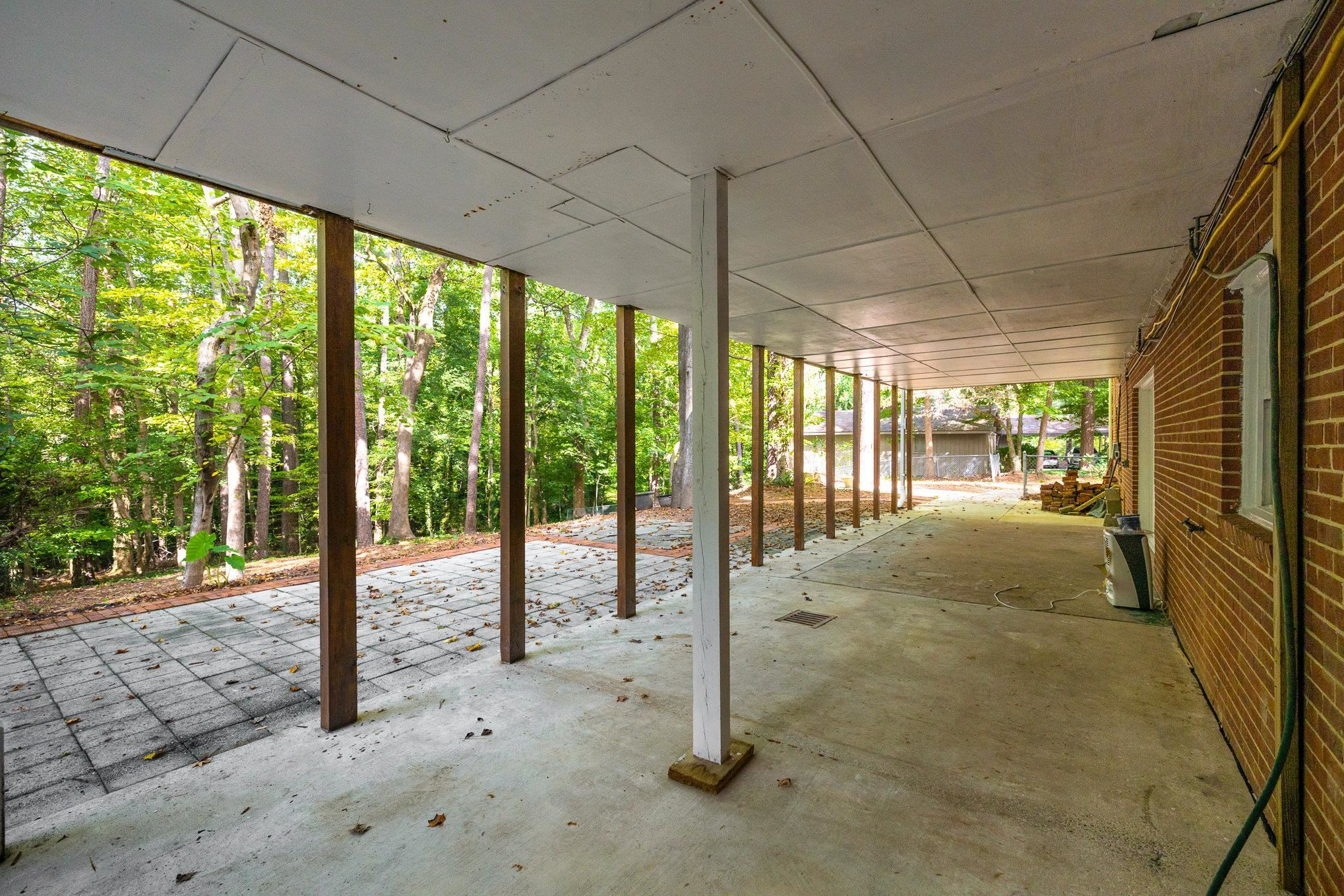 4921 Brookhaven Drive Raleigh, NC 27612 - Photo 21 of 39 Fantastic surprise out back with the great expanse of mature trees. Covered Back Patio