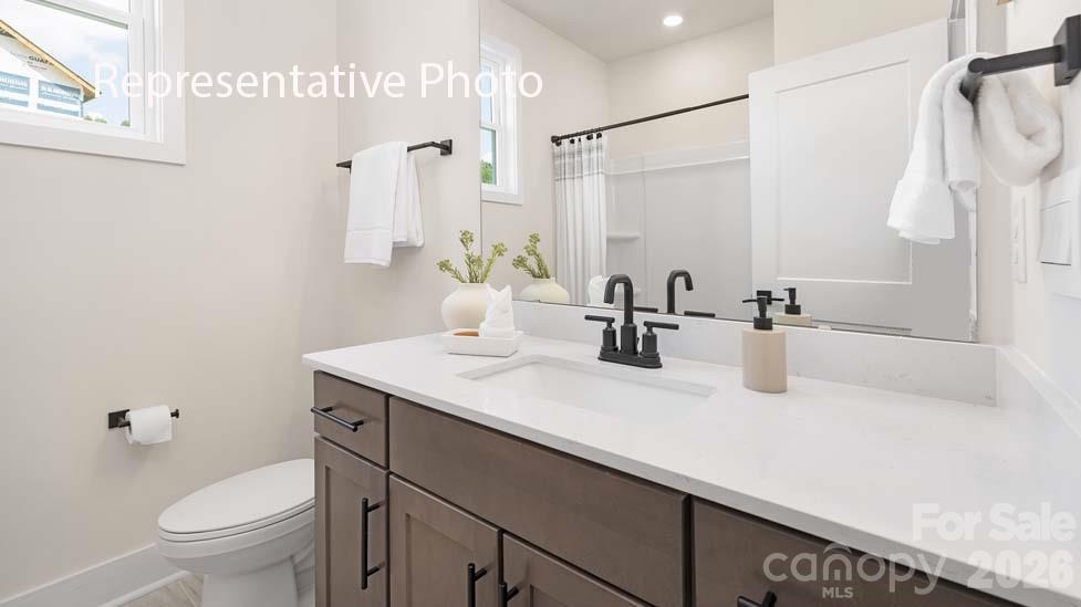 3040 Canvasback Way Indian Trail, NC 28079 - Photo 14 of 27 a bathroom with a sink toilet and shower