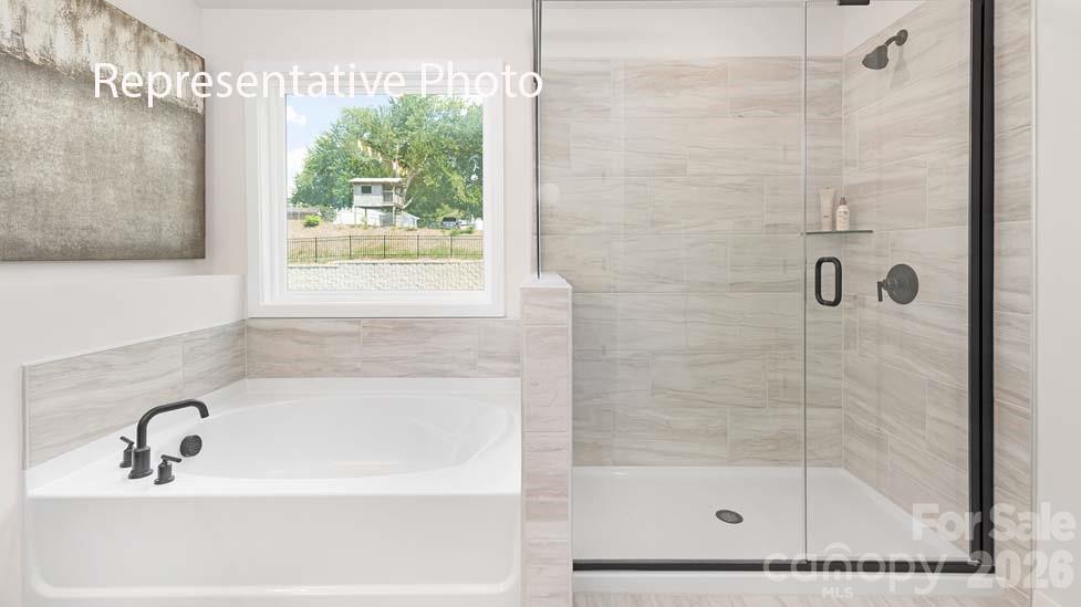 3040 Canvasback Way Indian Trail, NC 28079 - Photo 15 of 27 a bathroom with a shower