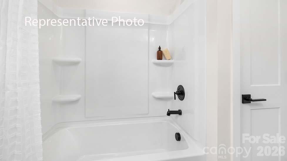 3040 Canvasback Way Indian Trail, NC 28079 - Photo 21 of 27 a bathroom with a bathtub