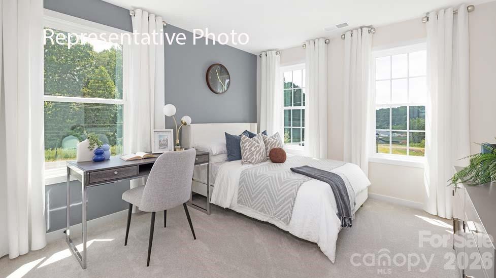 3040 Canvasback Way Indian Trail, NC 28079 - Photo 23 of 27 a bedroom with a bed and a window