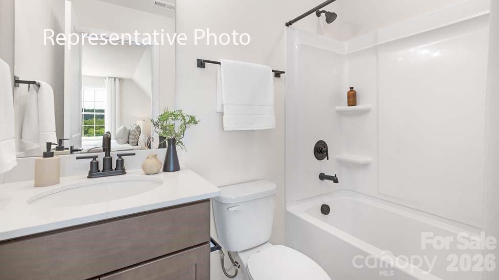 3040 Canvasback Way Indian Trail, NC 28079 - Photo 27 of 27 a bathroom with a sink a toilet and shower