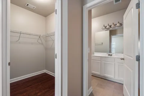 a bathroom with a shower and a sink