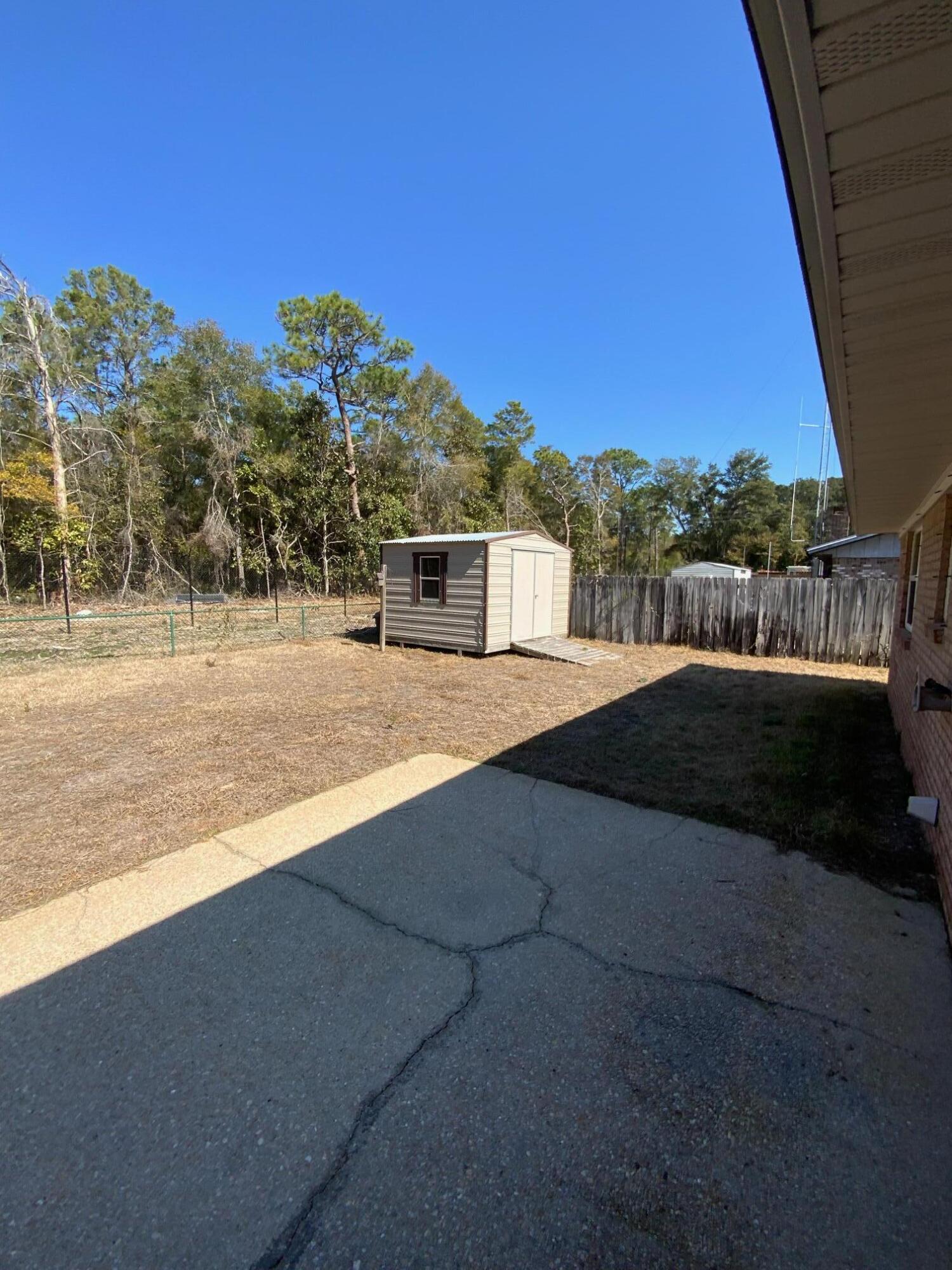 129 12th Avenue Shalimar, FL 32579 - Photo 14 of 20 a view of an outdoor space and swimming pool