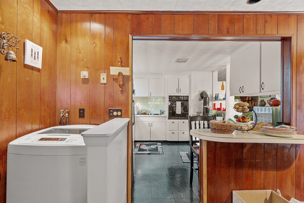 36 Brownlea Road Framingham, MA 01701 - Photo 15 of 24 a living room with stainless steel appliances kitchen island granite countertop furniture and a refrigerator