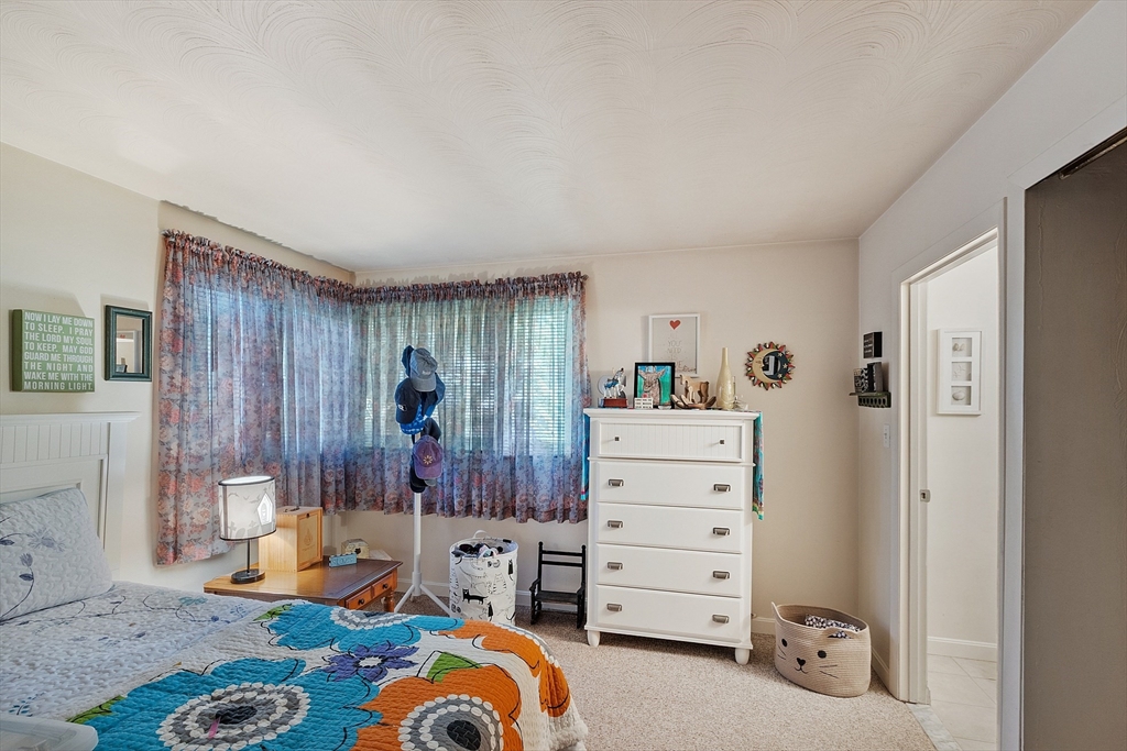 36 Brownlea Road Framingham, MA 01701 - Photo 22 of 24 a bedroom with furniture and a window