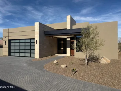 a view of a house with backyard